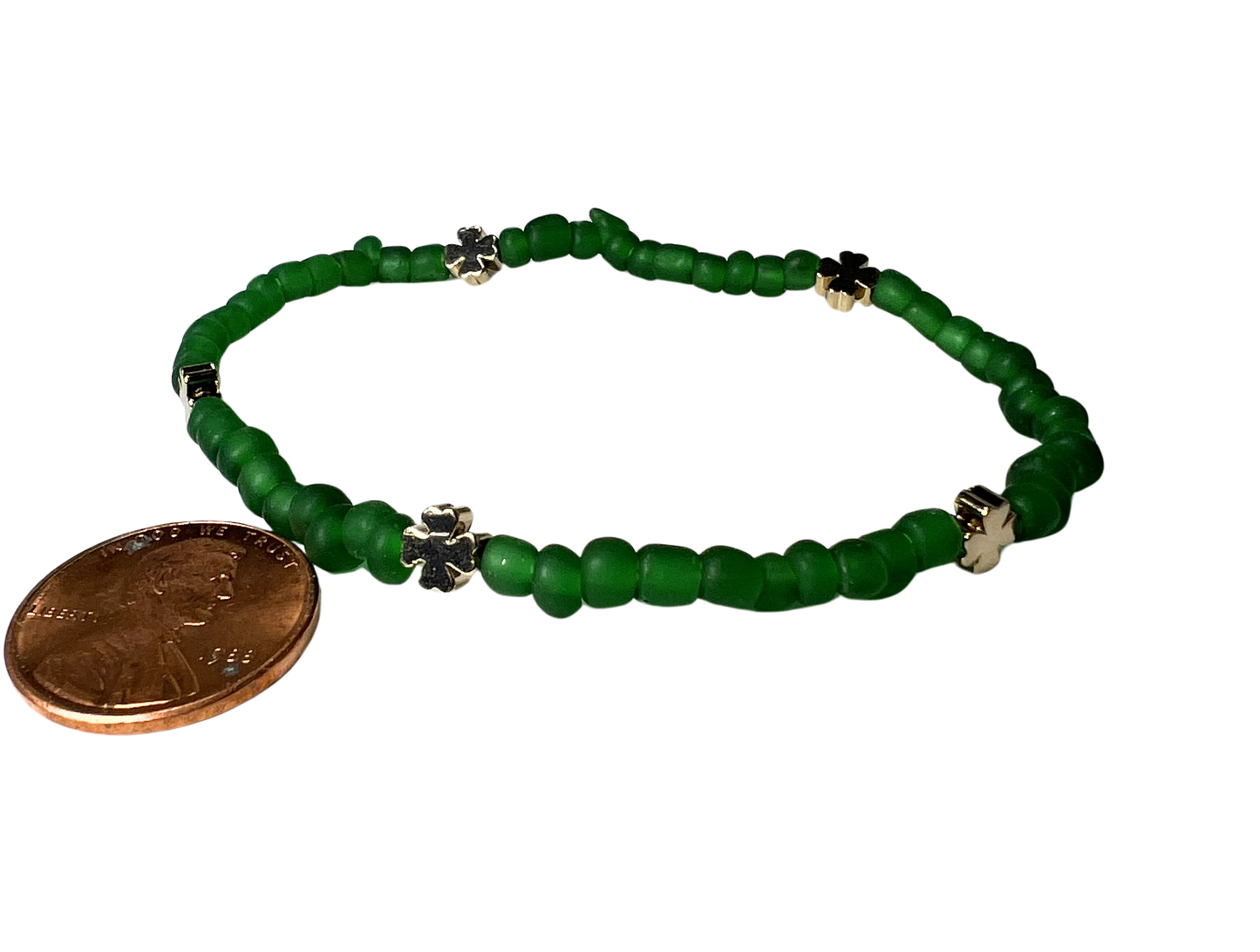 Clover Brass Bracelet on Green Bracelet